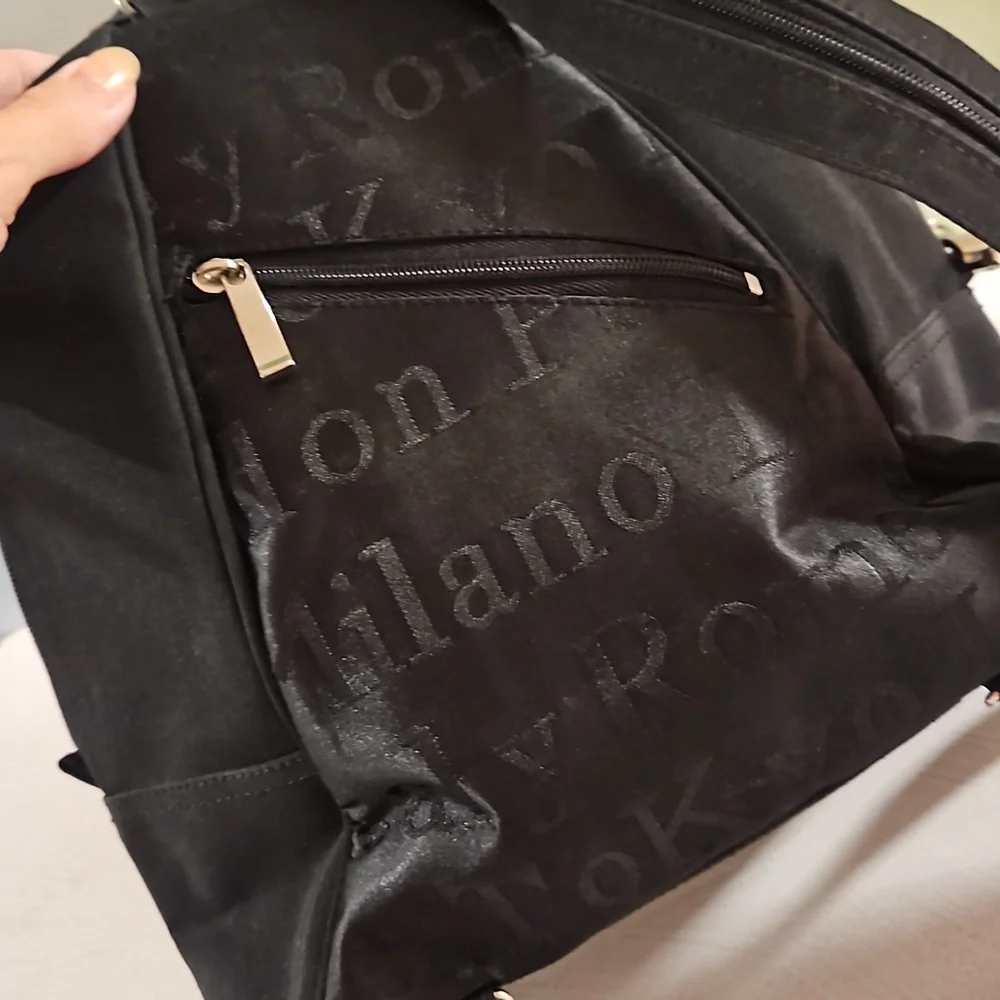 Black backpack convertible bag international city names on sections EUC